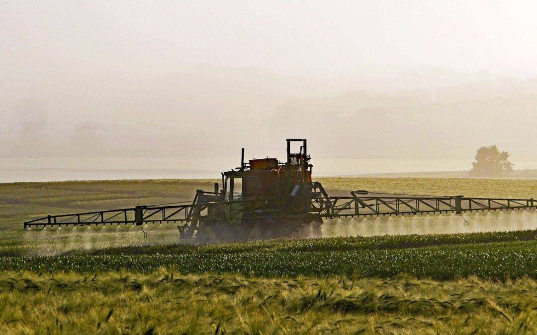 Spraying pesticides on a field