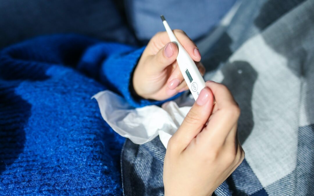 Woman holding thermometer