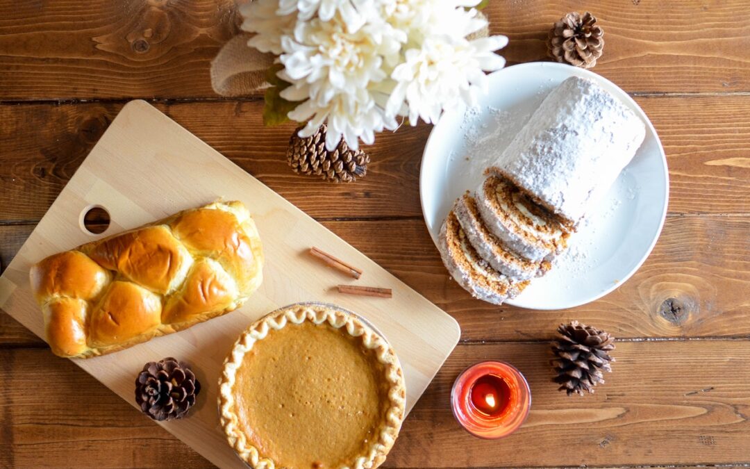 Pie, pastry, and bread roll on a table