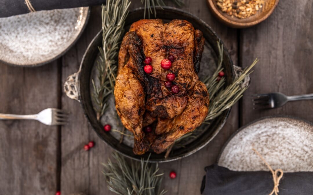 Roasted turkey with rosemary on a wooden table