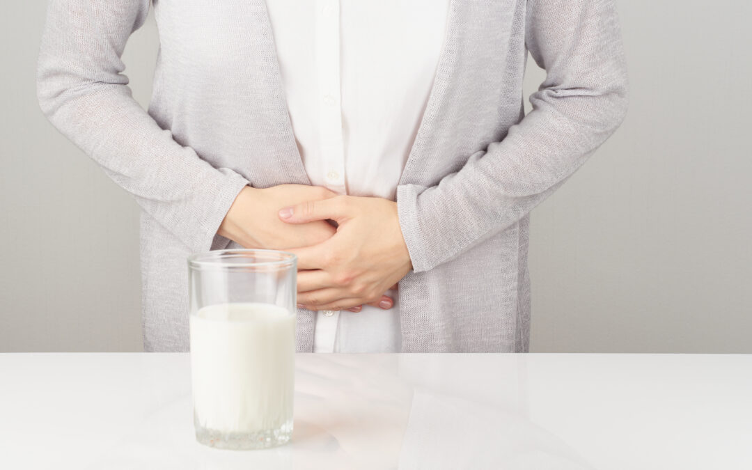 Woman clutching stomach after drinking milk
